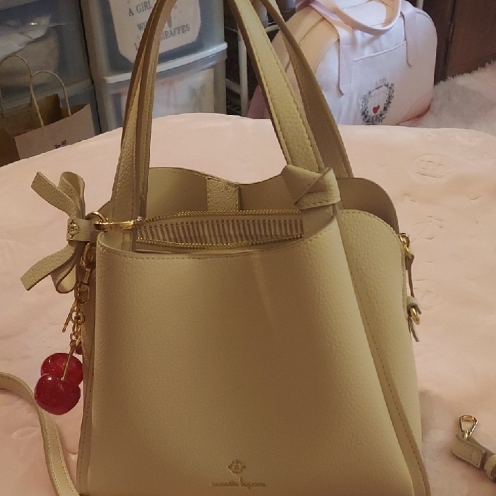 Nanette Lepore Cream Shoulder Bag with Bow and Cherry Charm, Crossbody Strap.